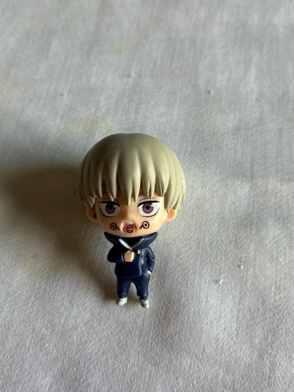 Anime Figure with Light Blonde Hair and Navy Outfit